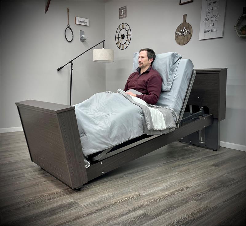 SelectCare with Mattress|SelectCare Width Adjustable|SelectCare Chair Position|4 Bed Rails Shown with Hand Pendant|Casters on SelectCare|Woodgrain Rails for SelectCare|High Height in Chair Position|Rails Flipped Down on SelectCare|SelectCare in Low Position|SelectCare with Single Set of Rails|SelectCare head and footboard stain options|Optional Bracket to hold a power mattress control box