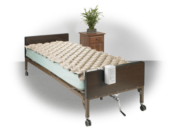 Med-Aire Alternating Pressure Pump and Pad System on mattress|Med Air Alt. Pressure Pump and Pad System Variable Pump and Pad w/ End Flap|Pressure pump is easy to use and hooks to end of bed for easy access|Med-Aire Alternating Pressure Pump and Pad System end flaps out
