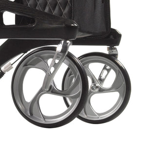 Nitro Elite Carbon Fiber Rollator by Drive Medical|Nitro Elite Carbon Fiber Rollator by Drive Medical with user|Closeup on Carbon Fiber on the Nitro Elite Rollator|Ample storage in the Nitro Elite Carbon Fiber Rollator|Easy to access hand brakes|Large, sleek wheels make the rollator look more modern|Nitro Elite Carbon Fiber Rollator by Drive Medical folds easily