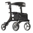Nitro Elite Carbon Fiber Rollator by Drive Medical|Nitro Elite Carbon Fiber Rollator by Drive Medical with user|Closeup on Carbon Fiber on the Nitro Elite Rollator|Ample storage in the Nitro Elite Carbon Fiber Rollator|Easy to access hand brakes|Large, sleek wheels make the rollator look more modern|Nitro Elite Carbon Fiber Rollator by Drive Medical folds easily