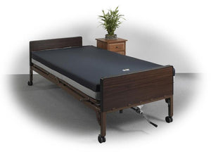 Prime Plus Expandable Hospital Bed Oak head and footboards|Remote with position including head and knee articulation, hi-low and trend and reverse trend.|Optional Bariatric Foam Mattress by Drive Medical shown with bed|Oversized head and footboard in cherry|Oversized head and footboard in oak|Oversized Head and Footboard  Mahogany