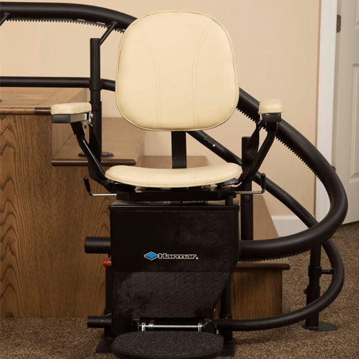 Helix Stair lift is custom made |Stair lift is custom fit to your unique staircase|Plush seat with flip up arms and wide, non-slip footrest|Great for spiral, 90 degree, or 180 degree staircases|Add accessibility to several flights of stairs with the Helix|Several finishes are available for the smooth glide rail|Seat easily folds to create more space on stairways|Curved stair lift can be used indoor or outdoor|Seat folds tight and compact|