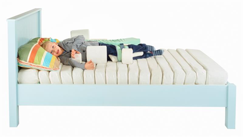 Dreama Jenx Mattress and Positioning Pads positioned for Side Lying