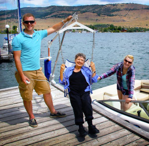 Aqua Creek Power EZ2 Pool or Boat Lift with user in sling|Aqua Creek Power EZ2 Pool or Boat Lift used with anchor|Aqua Creek Power EZ2 Pool or Boat Lift used as a boat lift|Use the Aqua Creek Power EZ2 Pool or Boat Lift on the dock!|Optional hard seat is made from hard plastic|Cover is available in three colors and a fade resistant blue|Hand controller comes standard and is waterproof|Solar powered battery charger keeps your battery constantly charged|Optional Anchor Kits for EZ2 pool lift