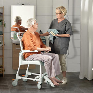 Etac Shower Commode Chair Over in use
