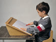 Child using the 30 Degree angle of Flip Top Easel by TherAdapt|45 Degree angle of Flip Top Easel by TherAdapt