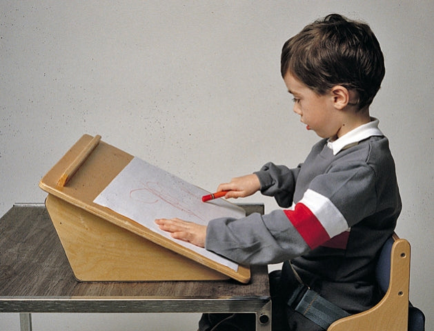 Child using the 30 Degree angle of Flip Top Easel by TherAdapt|45 Degree angle of Flip Top Easel by TherAdapt