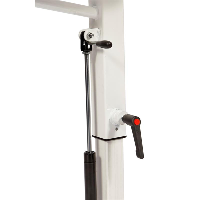 HCI Hydraulic UBE Table|Adjustable Arm adjusts height from 27"-37 and hydraulic pump|Turn knob allows user to lock casters in place to keep table more sturdy|Height adjustment allows for a variety of users to enjoy use of table|User with the HCI Hydraulic UBE Table and the Monark Ergometer