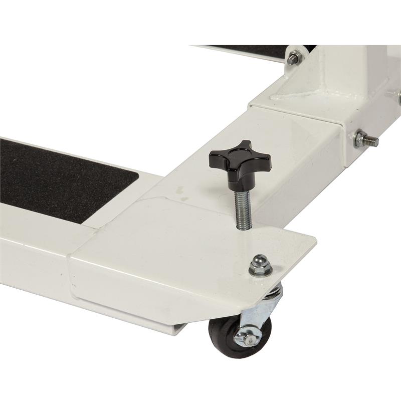 HCI Hydraulic UBE Table|Adjustable Arm adjusts height from 27"-37 and hydraulic pump|Turn knob allows user to lock casters in place to keep table more sturdy|Height adjustment allows for a variety of users to enjoy use of table|User with the HCI Hydraulic UBE Table and the Monark Ergometer