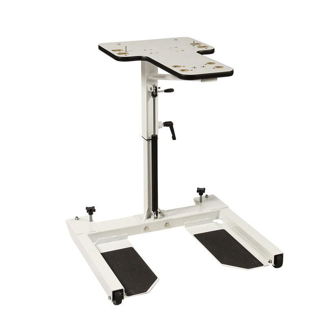 HCI Hydraulic UBE Table|Adjustable Arm adjusts height from 27"-37 and hydraulic pump|Turn knob allows user to lock casters in place to keep table more sturdy|Height adjustment allows for a variety of users to enjoy use of table|User with the HCI Hydraulic UBE Table and the Monark Ergometer