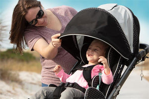 Little girl enjoying outdoor use with canopy