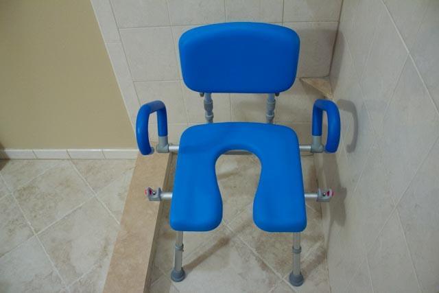 UltraCommode Folding Commode Chair in gray|UltraCommode Folding Commode Chair in blue|Fold compactly for ease of storage anywhere!|UltraCommode Folding Commode Chair folds compactly|Large commode pail comes standard|Chair is lightweight and portable|Seat can be used in the shower|UltraCommode Folding Commode Chair diagram