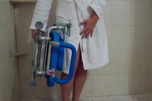 UltraCommode Folding Commode Chair in gray|UltraCommode Folding Commode Chair in blue|Fold compactly for ease of storage anywhere!|UltraCommode Folding Commode Chair folds compactly|Large commode pail comes standard|Chair is lightweight and portable|Seat can be used in the shower|UltraCommode Folding Commode Chair diagram