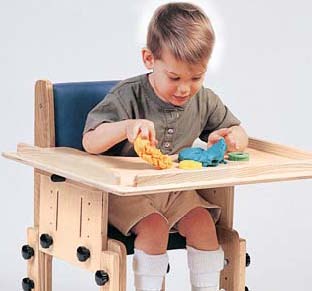School Chair by TherAdapt with user (Armrests and tray)