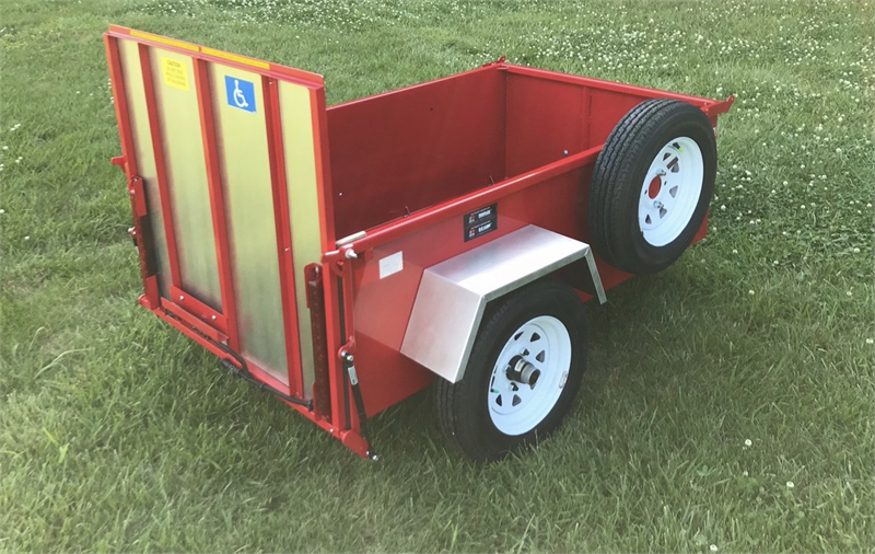 Ramp on ScootaTrailer folds up to hold scooter or wheelchair in place