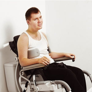 Heron Shower and Commode chair with user on toilet