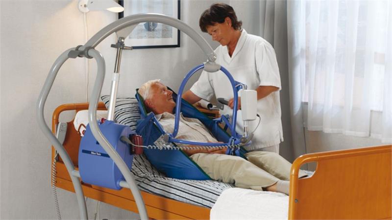 Arjohuntleigh Maxi Twin Patient Lift - Pictured with DPS Bar|Arjohuntleigh Maxi Twin Patient Lift with DPS Bar|Arjohuntleigh 2 Point Loop Sling Bar|Optional ArjoHuntleigh General Purpose Clip Sling with Padded Legs|Optional Arjohuntleigh Mesh Loop Sling with Head Support