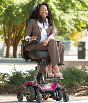 Happy rider on the Pink Jazzy Air 2 Power Wheelchair