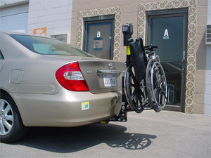 TriLift Ultra Lite Mobility Carrier holding manual wheelchair