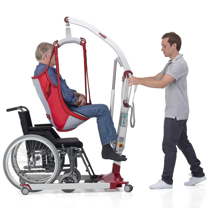 Patient being lifted to wheelchair in Molift Mobile Mover 180 Patient Lift