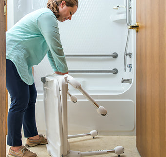 Tub transfer base legs fold for storage