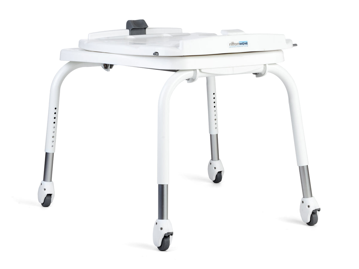 Tub transfer base for Rifton Wave Bath System|Sit in chair and roll back over the tub and set the brakes.|The bath chair is rotated 90° and feet move into tub.  Note: Take care to select the direction of the pivot, clockwise or counterclockwise (The tub transfer shown is pivoting clockwise.|Tub transfer legs fold for storage|Use the Tub Transfer manually or with a portable lift|2 leg heights, standard for tubs 20" or less from the floor and long for tubs greater than 20"|Wall hook included for wall storage