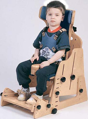 Winged Back insert with User in the Adjustable Positioning Chair